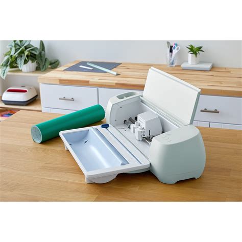 Cricut Roll Holder for SmartMaterials; Keeps rolled material aligned, for clean, precise cuts; Built-in trimmer ensures a straight edge every time; Fits rolls of Cricut Smart Materials™ from 4–75 ft (3–22.8 m); For Cricut Explore® 3 and Cricut Maker® 3